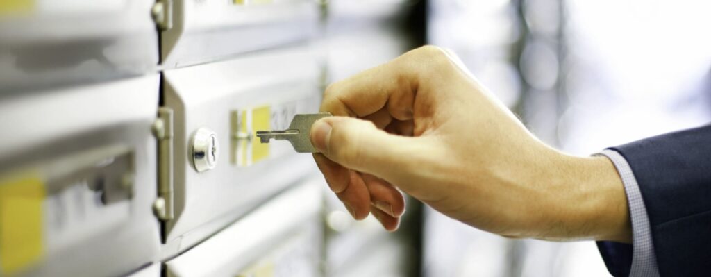 Hand opening safe deposit box with key