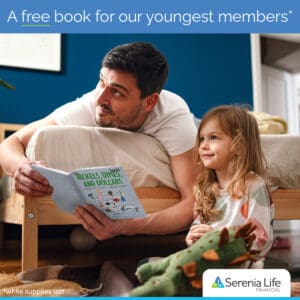 Dad and father reading financial literacy book together